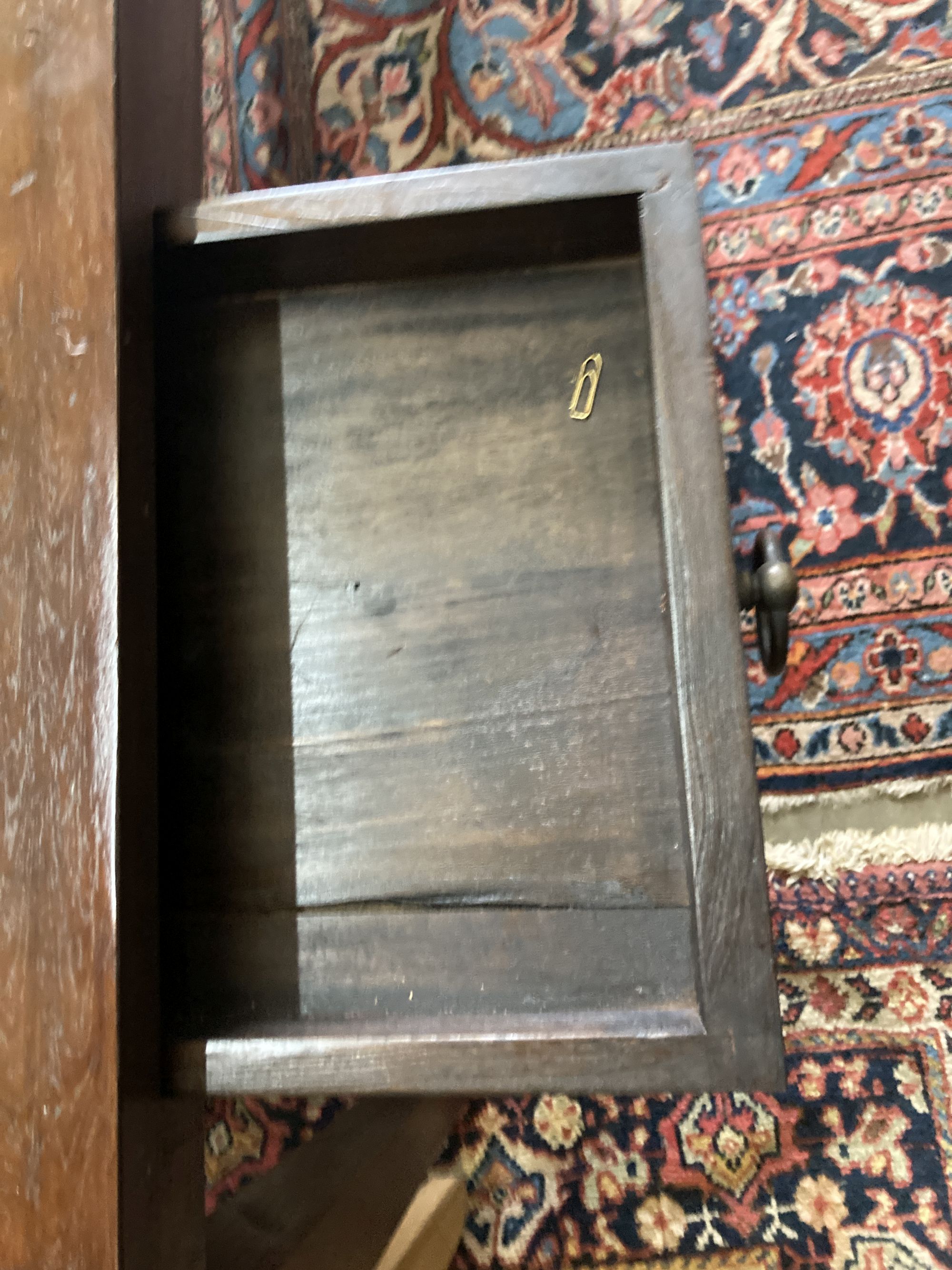 An Indian hardwood table, width 140cm, depth 40cm, height 76cm and a matching wall mirror